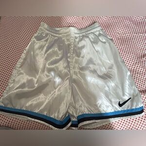 This is a vintage pair of shiny nylon Nike shorts.
Nike unisex. Size small(4-6)